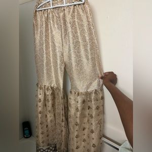 Brand New, made in Pakistan. The embroidery is handmade and stitched on.